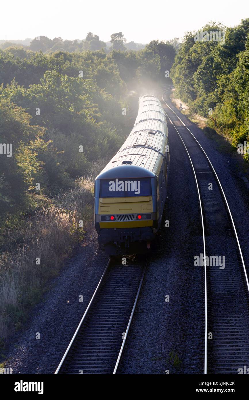 Chiltern Railways Mainline train heading north on a summer`s evening, Shrewley, Warwickshire, UK Stock Photo